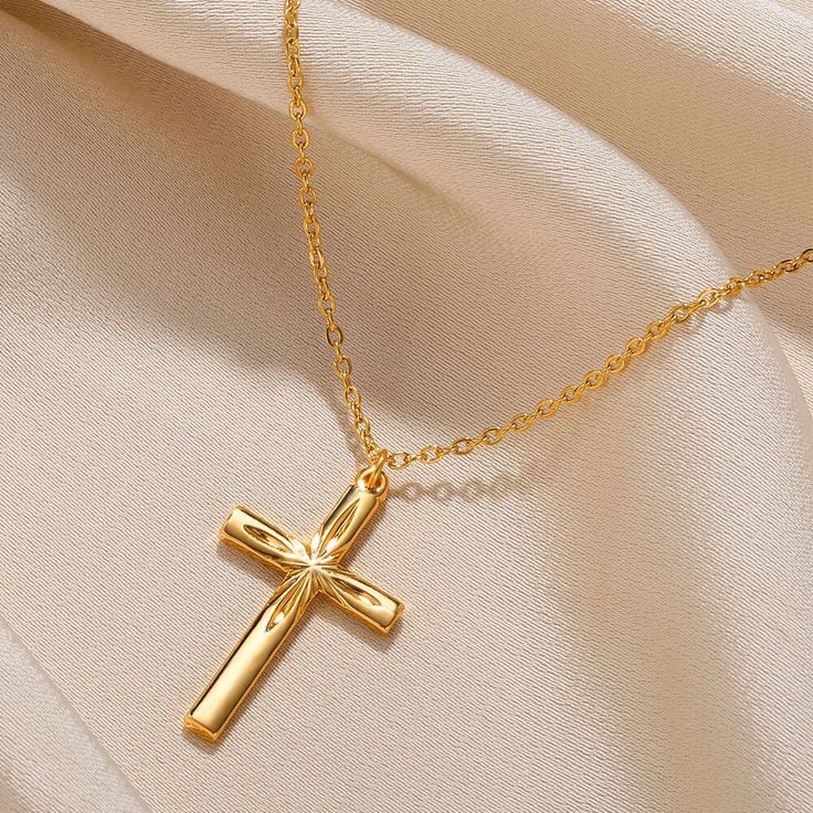Gold cross pendant